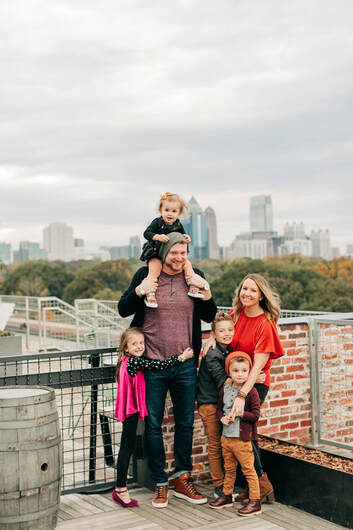 lifestyle photographer, carly laine, with her family at Ponce City Market in Atlanta